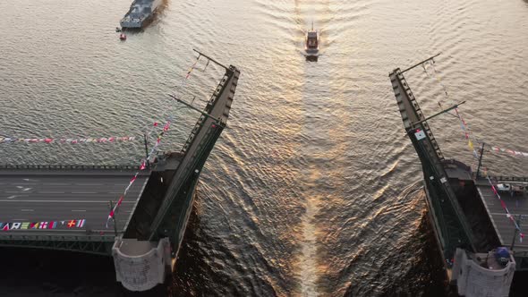 Aerial Landscape of Warship Pass Under a Raised Palace Drawbridge Top View Black Color of Water the