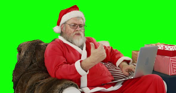 Santa claus using laptop