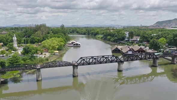 Aerial view of River Kwai Bridge with train rail way with Chao Phraya River,