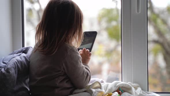 Toddler Child Using Phone at Home, Taking Photos and Playing Games