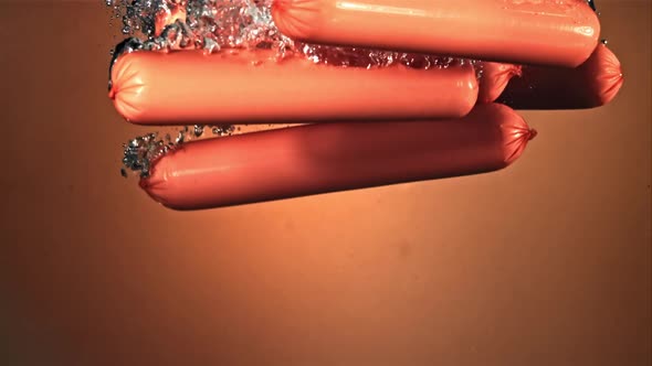 Sausages Fall Into the Water with Air Bubbles