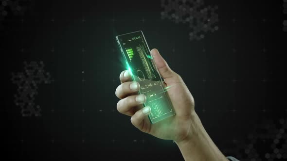 Hand holding futuristic mobile phone against digitally generated background