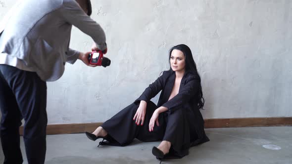 A Beautiful Woman Topless Sitting on Floor