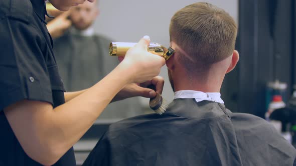 Haircut of a Young Guy in a Hairdresser