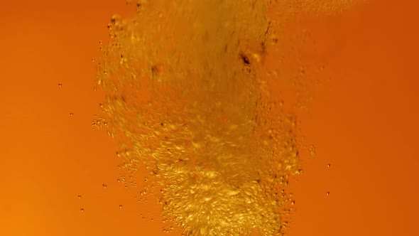 Detail of a Beer Glass with Carbonated Liquid