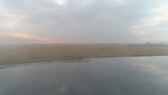 Flying Over Foggy Lake