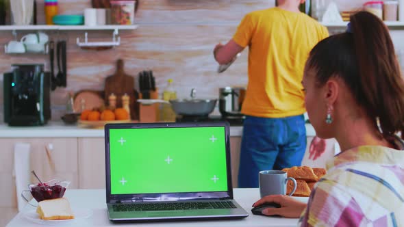 Entrepreneur Working on Laptop with Green Screen