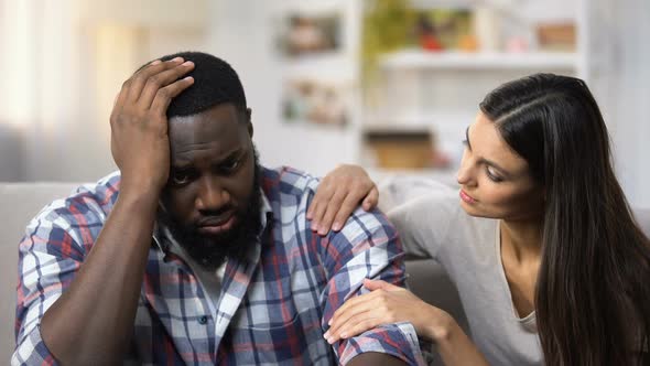 Caucasian Woman Supporting African-American Boyfriend, Life Problems, Stress