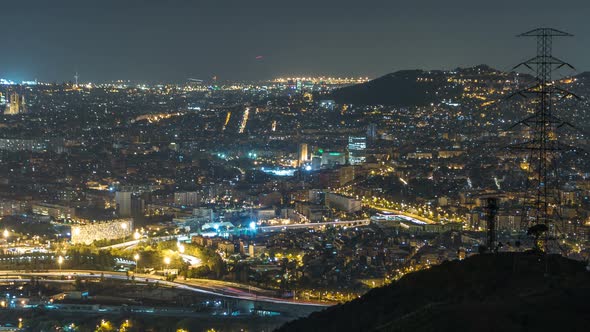 Barcelona and Badalona Skyline with Roofs of Houses and Sea on the Horizon Night Timelapse