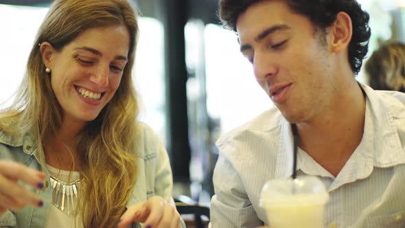 Couple dining at fast food restaurant