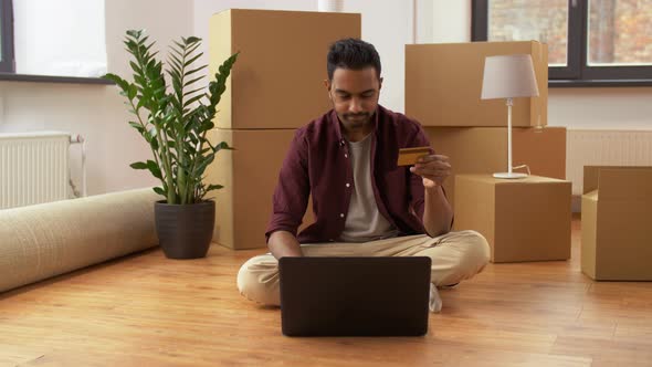 Indian Man with Laptop Shopping Online at New Home 4