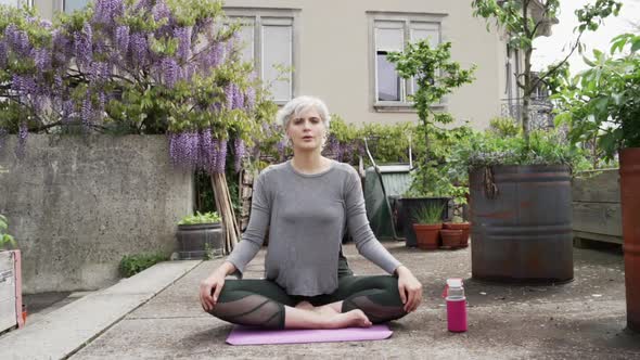 Woman doing Yoga on a rooftop