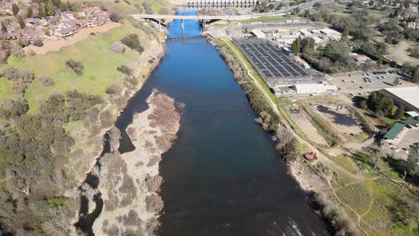 Aerial footage of The Nimbus fish Hatchery and Nimbus Dam on the American River near Folsom, Califor