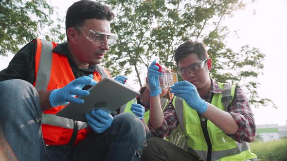 Scientist team checks pH value of factory wastewater by the Colorimetric method.