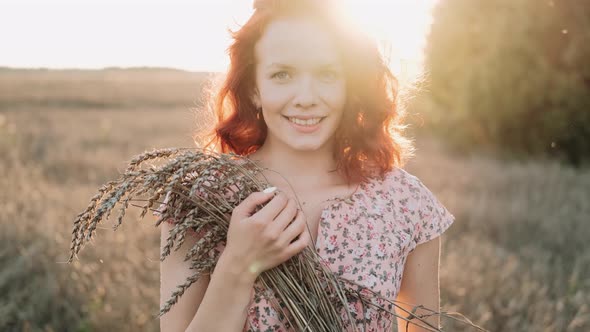 Portrait of a Beautiful Redhead Girl at Sunset