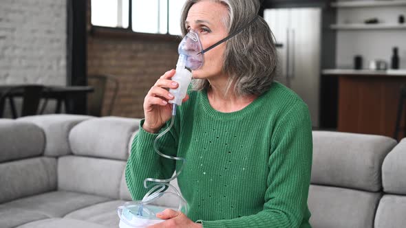 Sick Senior Woman Making Inhalation at Home