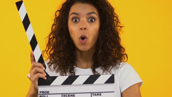 Astonished Girl Using Clapper Board, Shocking Content, Highest-Rated Movie