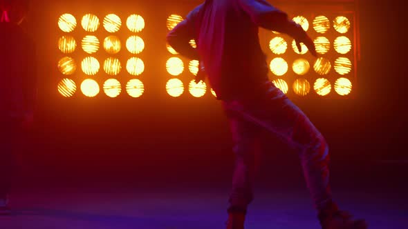 Breakdance Guy Showing Dance Elements in Spotlight