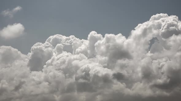 Cumulus Clouds Moving in Sunny Weather alt