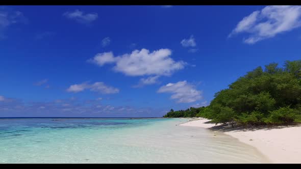 Aerial drone shot scenery of perfect coast beach adventure by transparent ocean and white sandy back