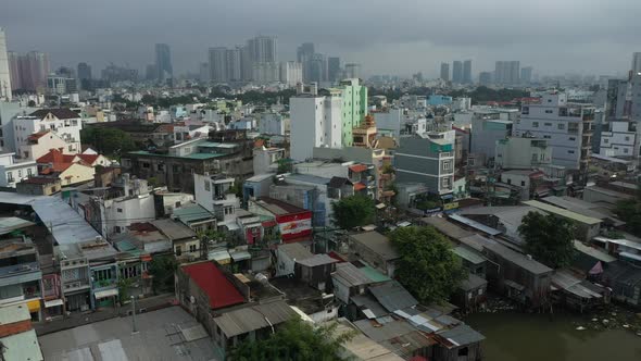 Saigon, Ho Chi Minh City, Vietnam early morning sunny drone footage flying in over Kenh Te canal and