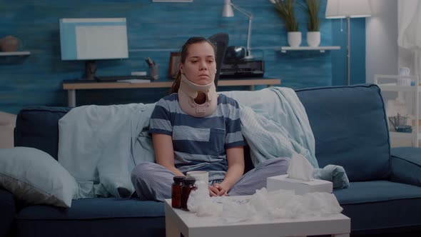 Injured Woman Wearing Cervical Collar for Neck Pain