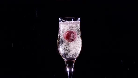 Strawberry Splash in a Champagne Flute. Slow Motion. alt