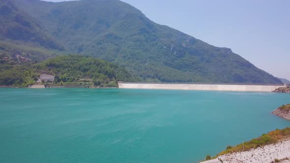 Top view of blue reservoir in mountains