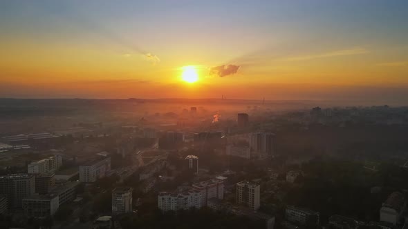 Aerial drone view of Chisinau at sunrise. Panorama view of multiple buildings, roads. Moldova