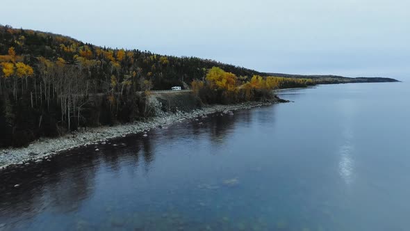 Drone flies to coastal road, Great Lakes region, Lake Superior, Ontario, Canada