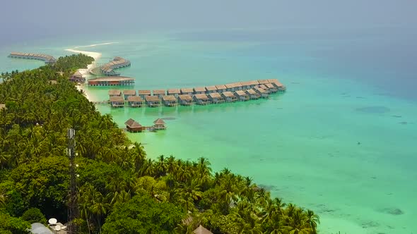 Aerial abstract of tourist beach trip by blue lagoon with sand background