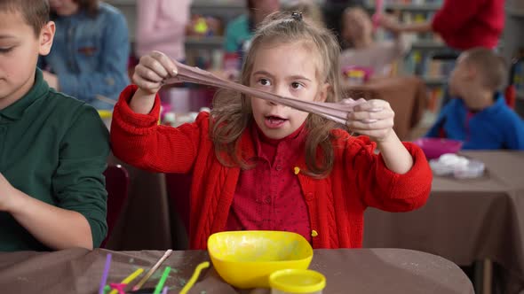 Cute Autistic Girl Stretching Slime at Masterclass