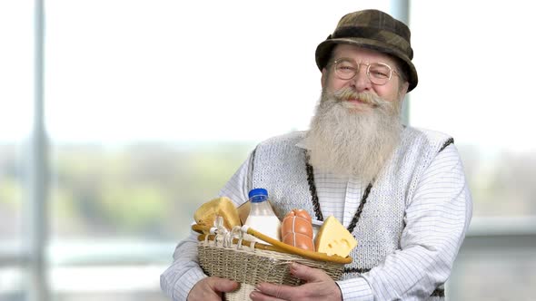 Old Retired Man with Basket with Food