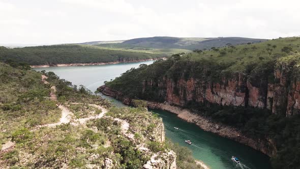 Cinematic drone footage - flying sideways over the river showing a mountains at minas gerais in Braz