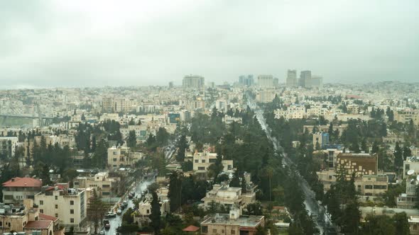 Amman, Jordan on a rainy, foggy day as seen from a high hotel window - time lapse