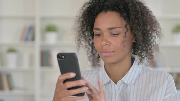 Attractive African Woman Using Smartphone