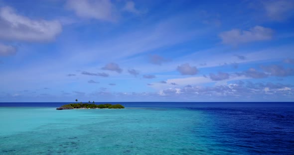 Tropical birds eye copy space shot of a white sandy paradise beach and blue water background in best