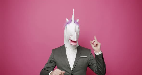 Guy in Gray Suits with Unicorn Mask Have a Good Idea