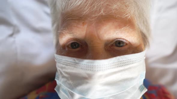 Portrait of Old Woman Wearing Protective Mask From Virus. Sick Elderly Lady with Medical Face Mask