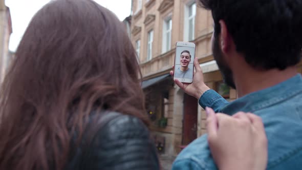 Video communication. Closeup couple using phone for video call