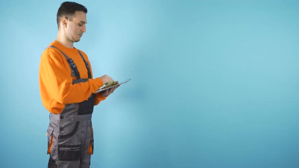 Young Male Professionals Working on Tablets in Studio with Copy Space 