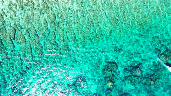 Aerial sky of exotic seashore beach journey by blue green lagoon with white sand background of a day