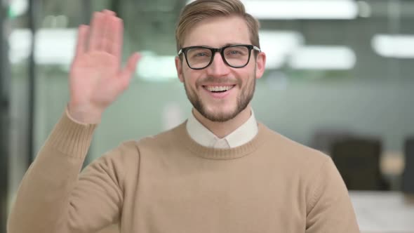 Young Creative Man Waving Welcoming