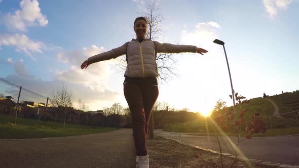 Young woman enjoying a walk at park