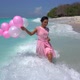 Cute Happy Woman in Pink with Balloons Walking in the Splashing Ocean Water Birthday Party on the - VideoHive Item for Sale