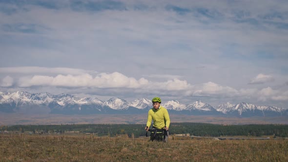 The Man Travel on Mixed Terrain Cycle Touring with Bikepacking