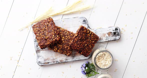  of Whole Grain Bread with Sunflower Seeds on a Rustic Wooden Board