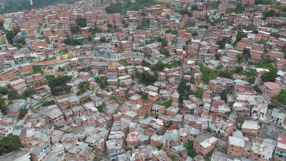 Cityscape of colorful brick houses in Comuna 13 Neighborhood poverty slum in Medellin Colombia - aer