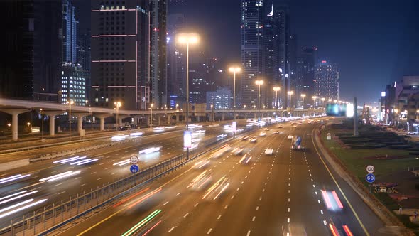 Bright Illuminated Radiant Buildings and City Roads at Night 