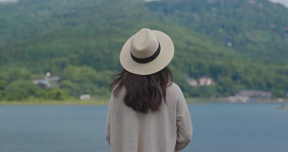 Woman look at the lake in countryside